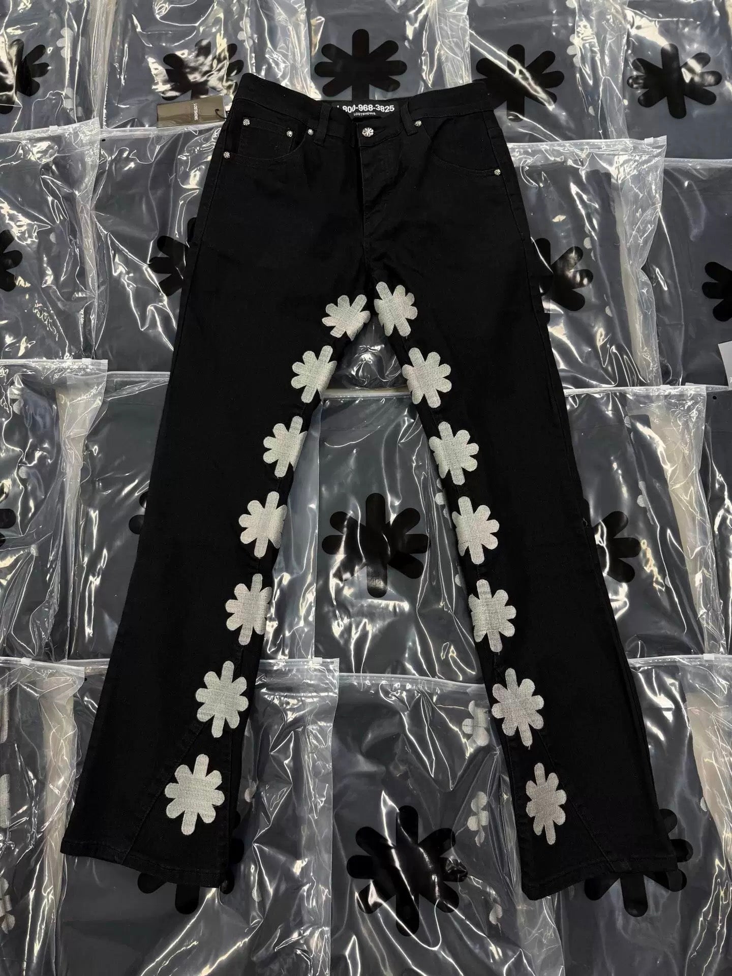 S Flower Stacked Flared Jeans